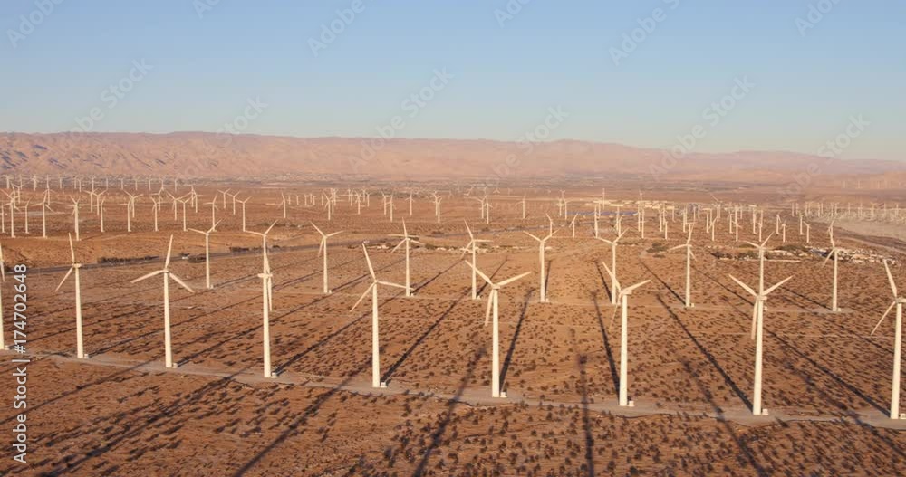 Aerial View Windmill Turbines Producing Clean Sustainable Energy At Sunset Aerial View Windmill Turbines Producing Clean Sustainable Energy At Sunset