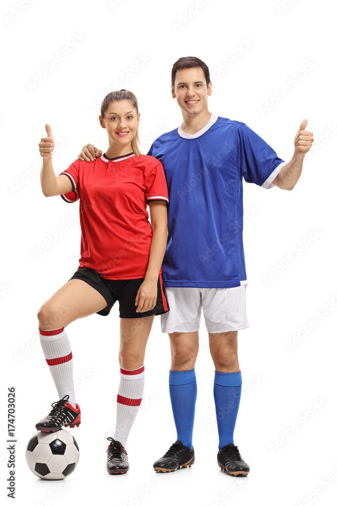 Female and a male soccer players making thumb up gestures