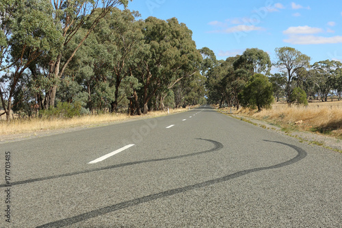 tyre skid marks on a country road