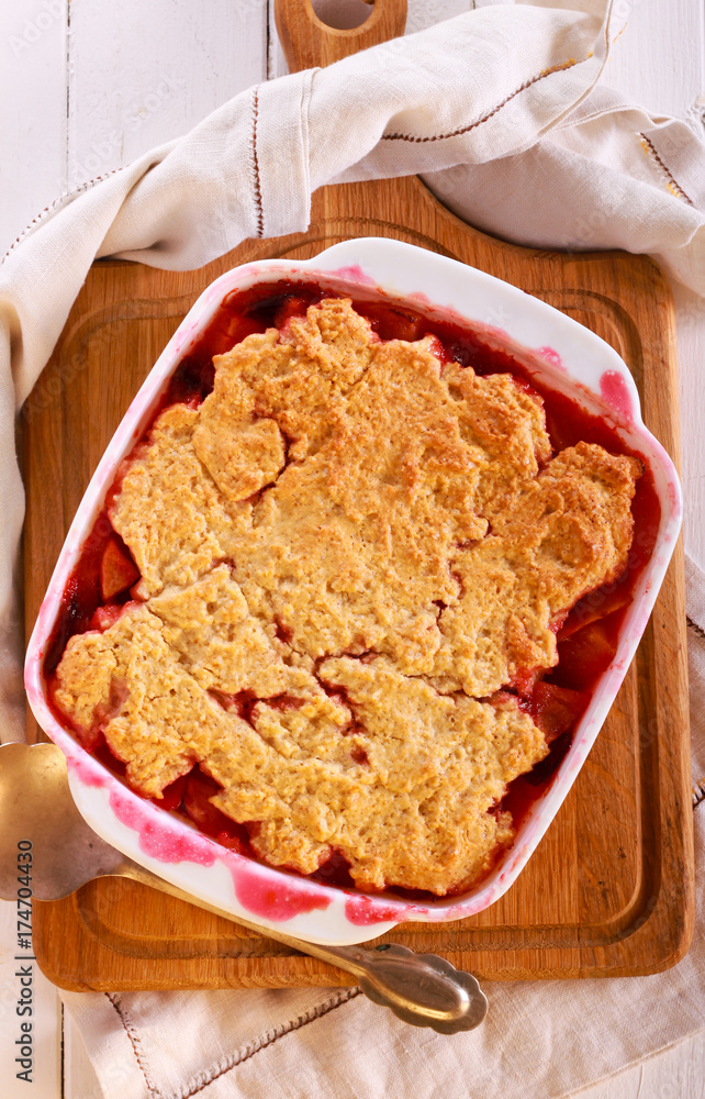 Plum and apple cobbler in a tin Plum and apple cobbler in a tin