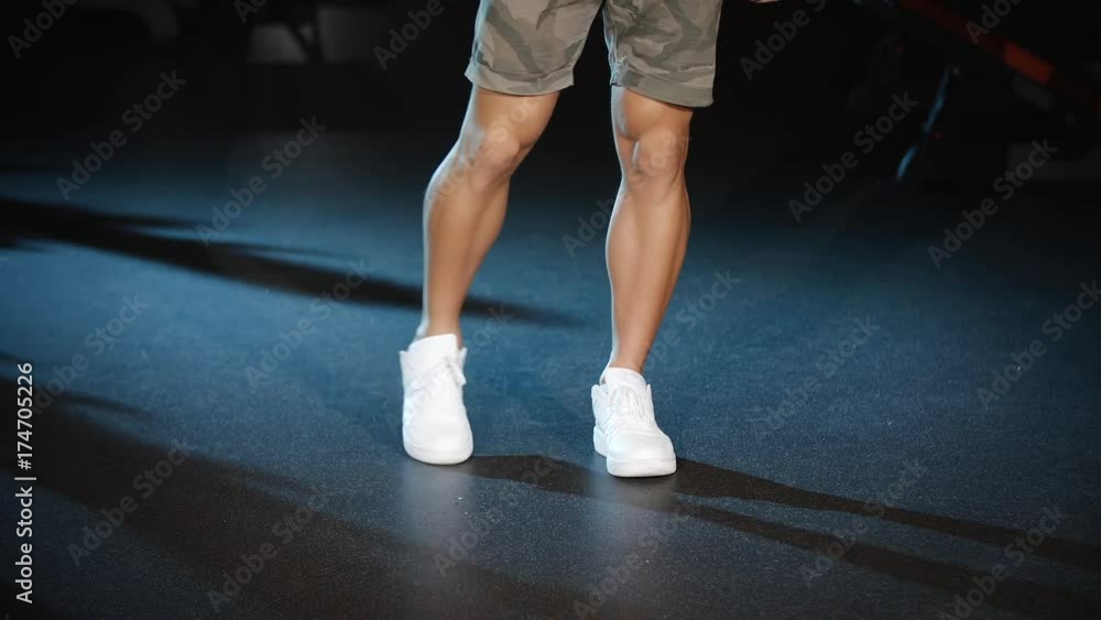 Handsome man workout and trains legs joins and knees circle exercises Handsome man workout and trains legs joins and knees circle exercises