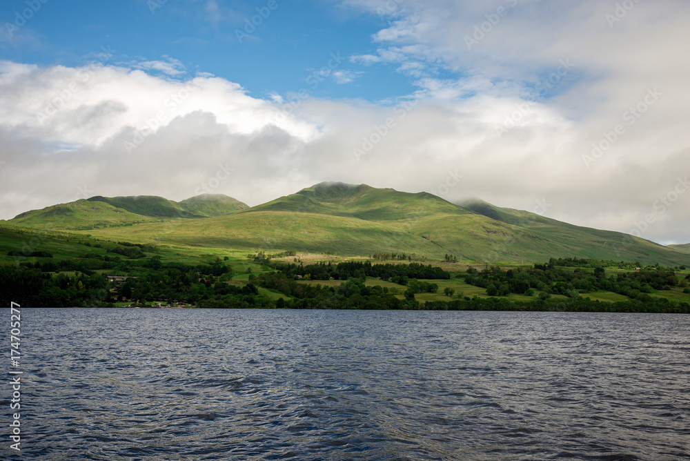 Cloudy summer highlands landscape at Loch Tay scenic coastline, central Scotland