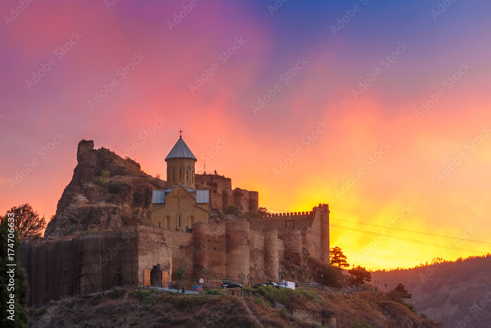 Amazing View of Narikala ancient fortress with St Nicholas Church at gorgeous sunset, Tbilisi, Georgia.