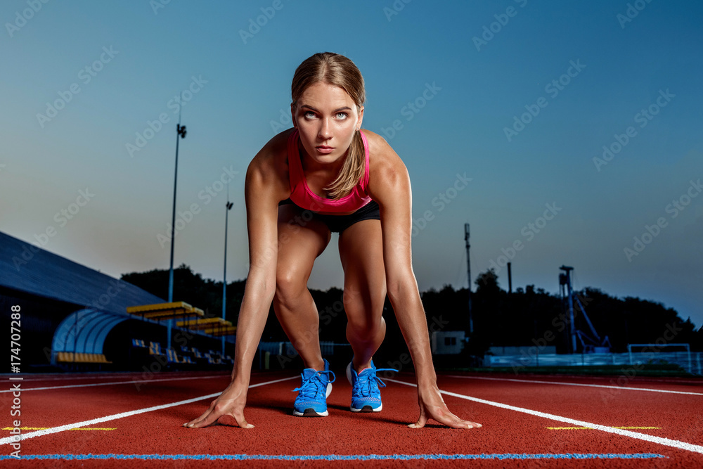 Portrait of beautiful woman ready to start running. Portrait of beautiful woman ready to start running.