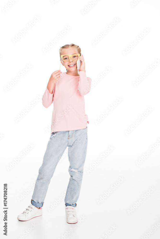 child with cardboard glasses and smartphone child with cardboard glasses and smartphone