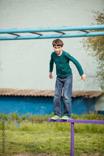 young happy child boy in adventure park