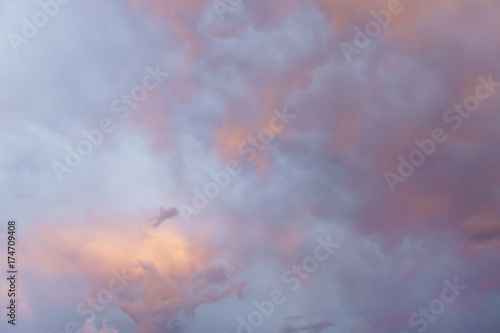 view on the beautiful blue orange evening sunset sky with clouds.