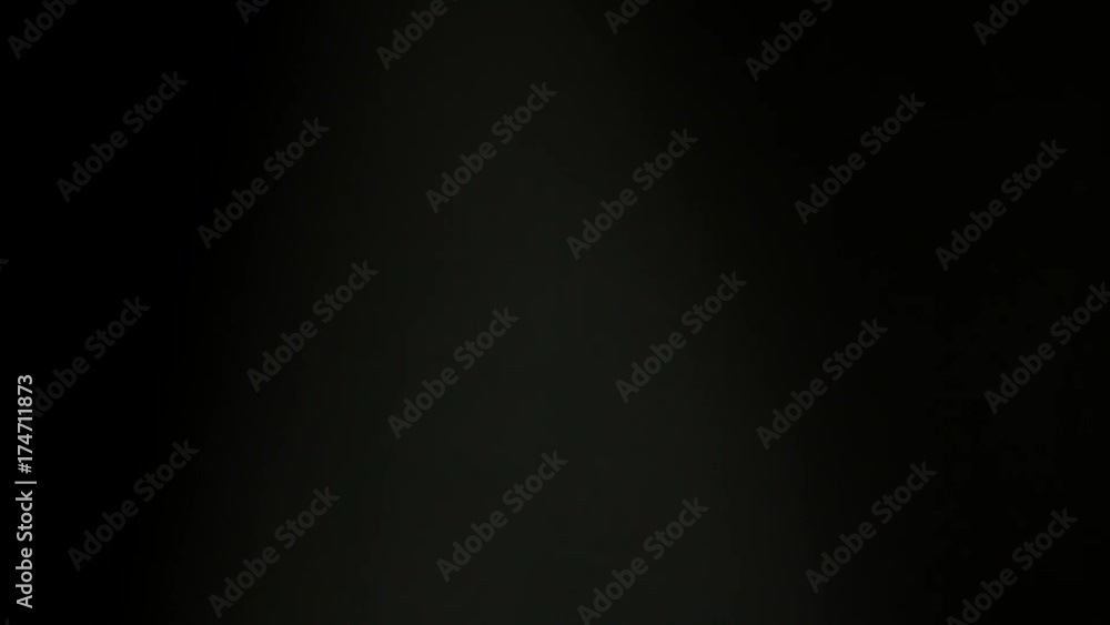 Winning man exulting looking at camera on neutral background Winning man exulting looking at camera on neutral background
