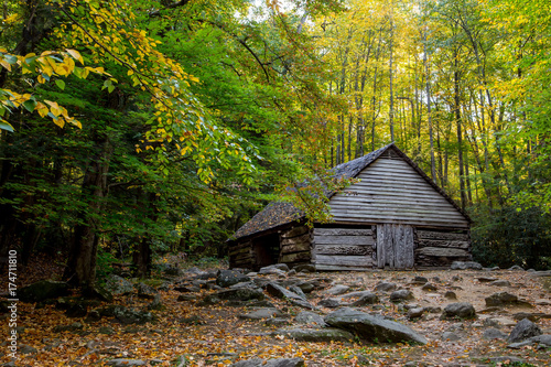 Antique Wooden Barn With Fall Foliage