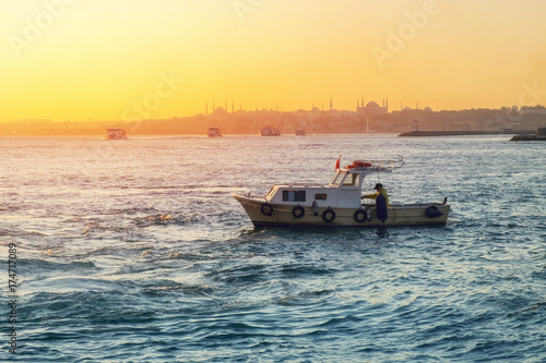 Evening Bosphorus sunset with boat Istanbul October photo