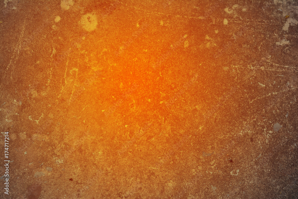 Obraz premium the background of dirty cement and orange light