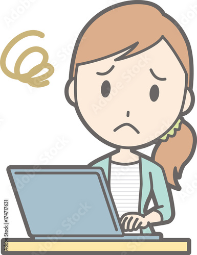 A young woman in striped clothes is troubled by operating a laptop computer