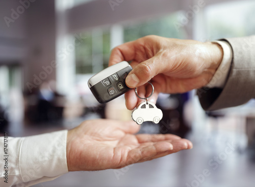 Car sales buying a new car handing over the key
