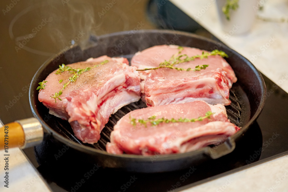 Roasted fresh pork meat steak in a frying grill pan