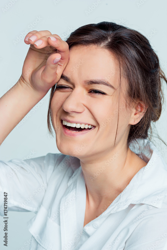The young woman's portrait with happy emotions The young woman's portrait with happy emotions