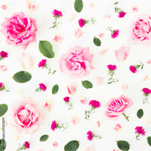 Floral pattern with pink roses, petals and leaves on white background. Flat lay, top view. Flowers background