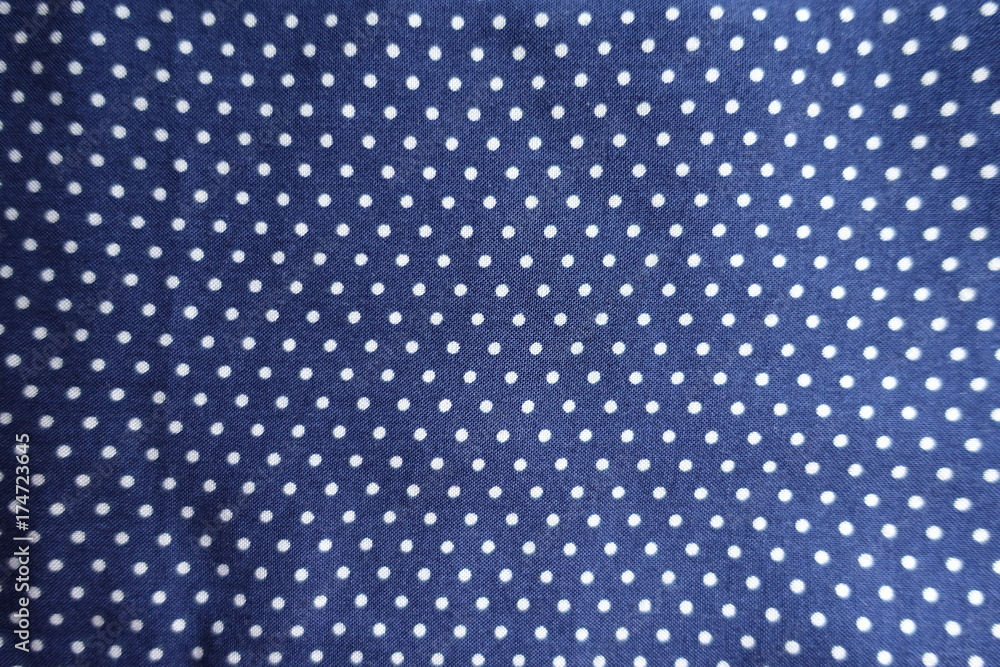 Blue fabric with polka dot print from above Blue fabric with polka dot print from above