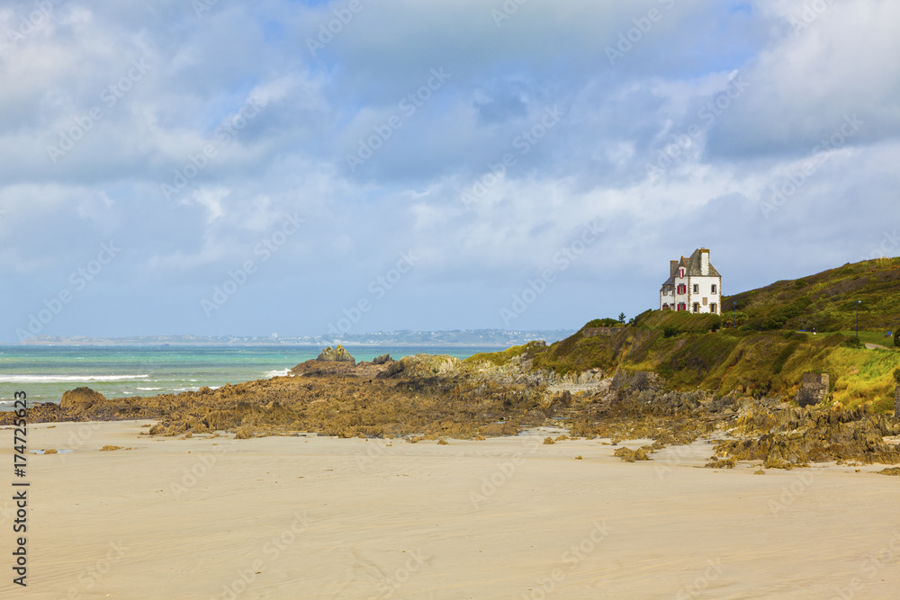 Brittany landscape at Pointe du Locquirec with typical house above the beach
