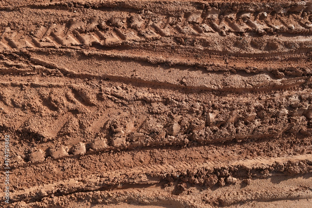 tire track of many vehicle on soil mud road in countryside in rainy season tire track of many vehicle on soil mud road in countryside in rainy season