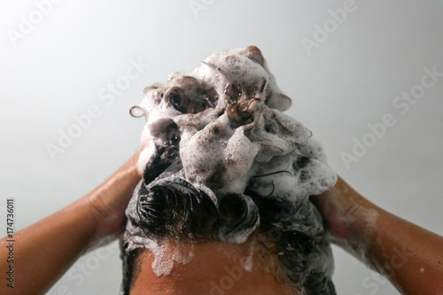 Women are washing hair with shampoo in the bathroom.