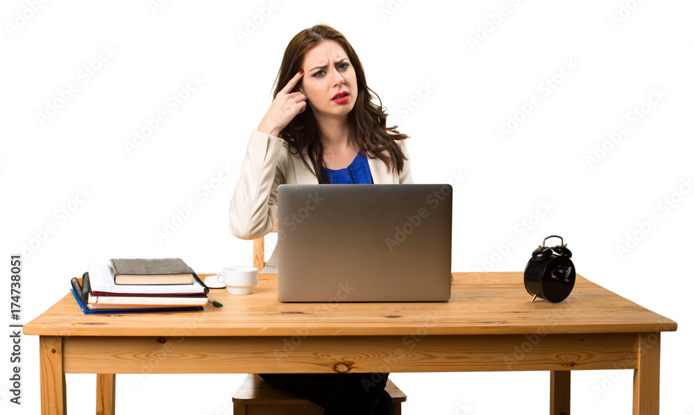 Business woman working with her laptop and making crazy gesture Business woman working with her laptop and making crazy gesture