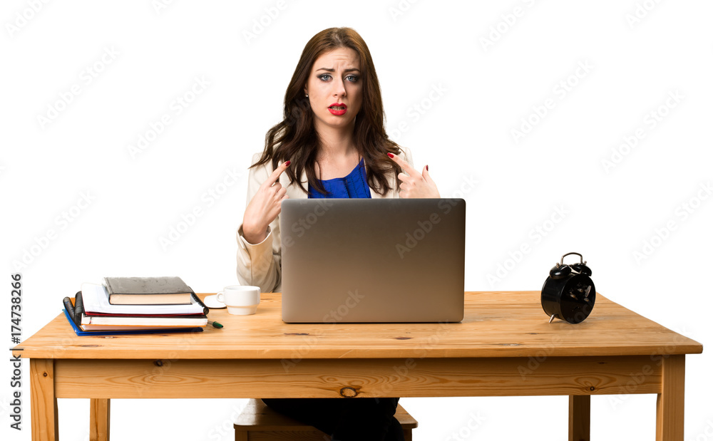 Business woman working with her laptop and making surprise gesture Business woman working with her laptop and making surprise gesture