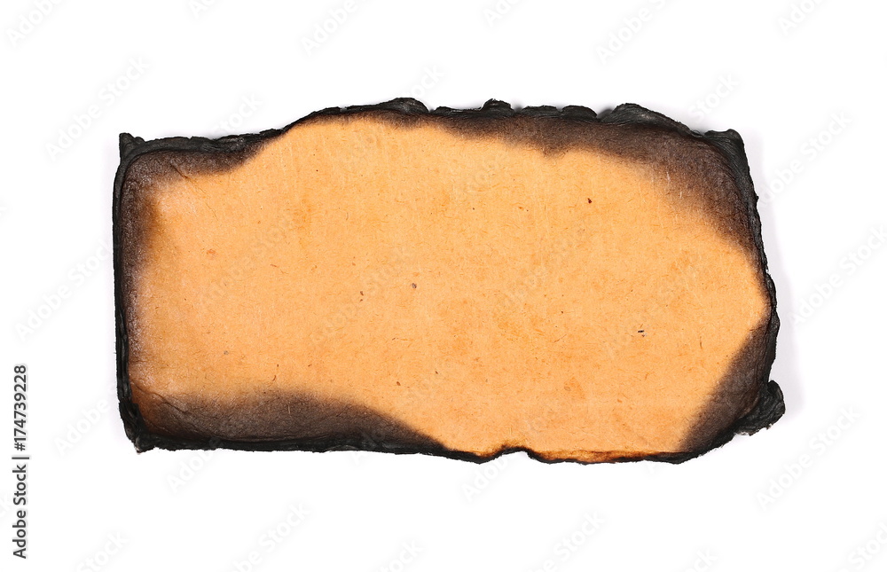 Old burning brown cardboard isolated on white background