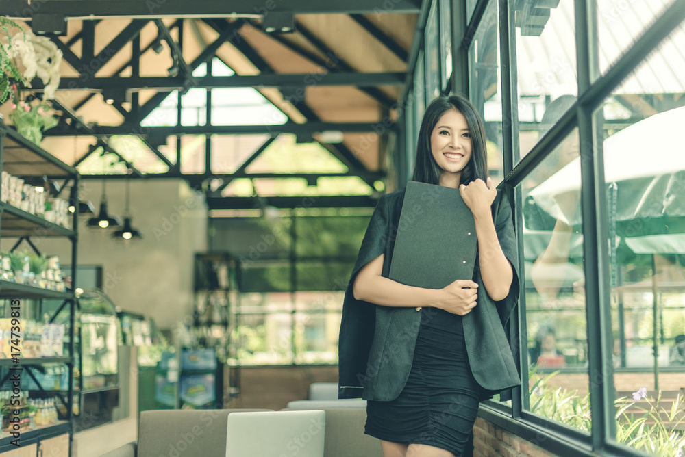 Modern business woman in the office with copy space, smiling business woman. Middle age beautiful and smiling business woman. Selective focus