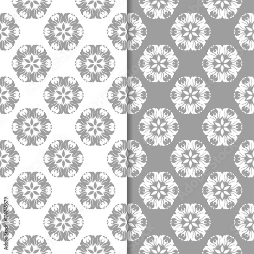 White and gray floral ornamental designs. Set of seamless patterns © Liudmyla