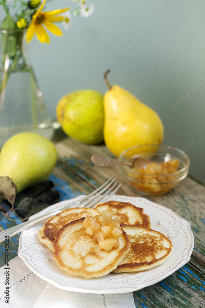 Pancake with pear compote, breakfast. Rustic style, selective focus. Pancake with pear compote, breakfast. Rustic style, selective focus.