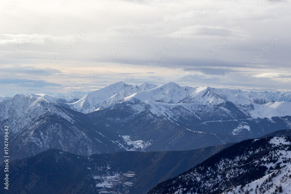 View to the snowy mountains called Wetterstein with a dramatic clouded