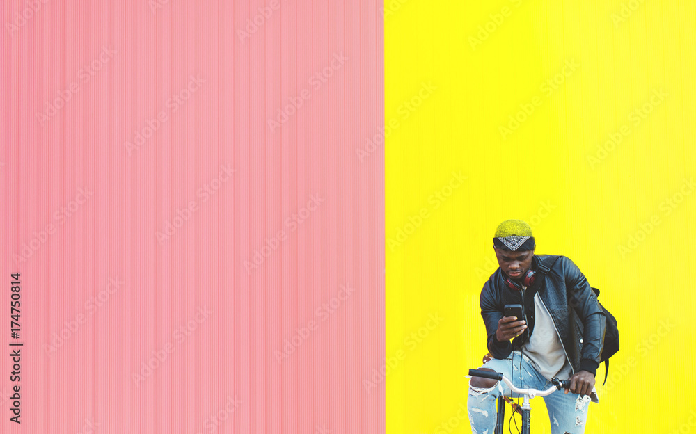 African young man with fixed gear bicycle. African young man with fixed gear bicycle.