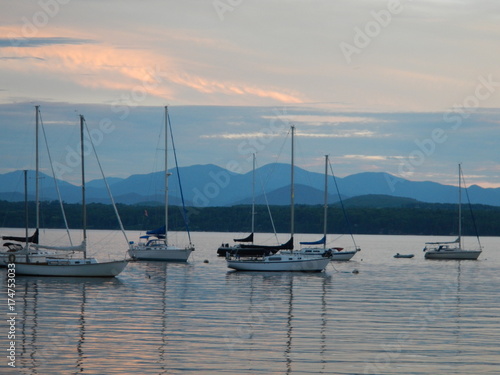 sunrise, sunset, sailboat, boat, mountains, lake,ocean, beautiful, beach, sea, water, sky, foam, waves © Laura