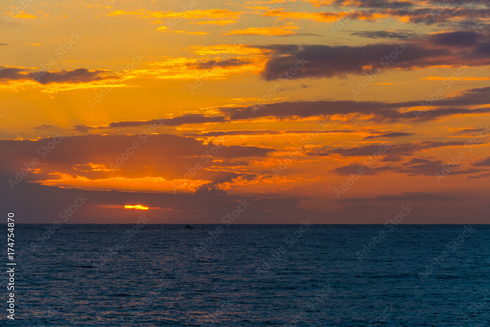 Dark clouds over the sea at sunset Dark clouds over the sea at sunset