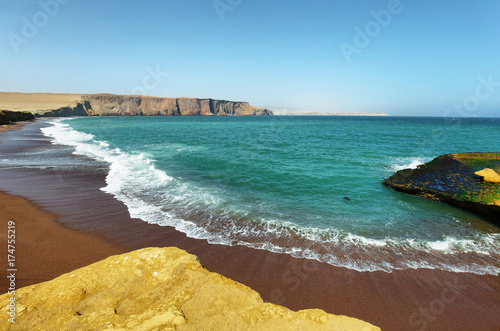 Red sand beach of Paracas National Reserve in Peru photo