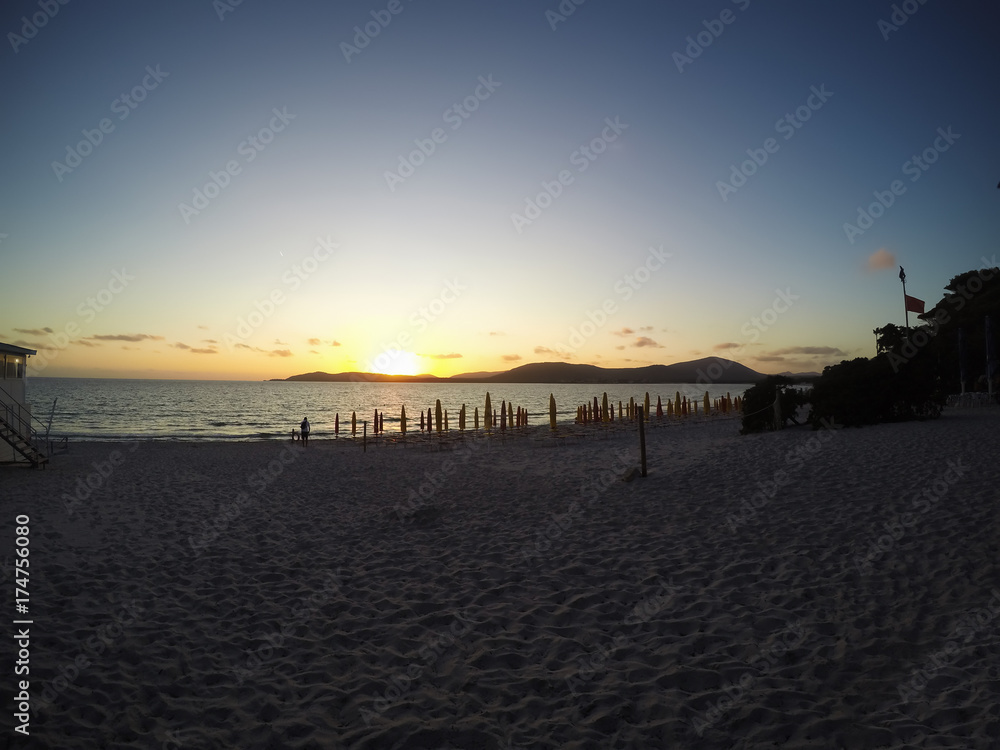 Clear sky over Alghero shore at sunset