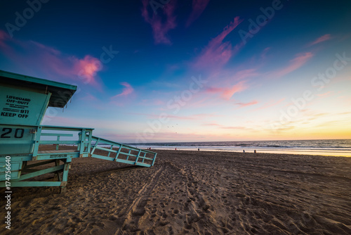 Colorful sky over a lifeguard hut