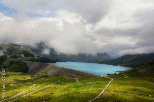 Spectacular Mont-Cenis lake and barrage near Lanslebourg-Mont-Cenis (Savoie, Auvergne-Rhone-Alps),Col du Mont Cenis who connects Val Cenis in France in the northwest with Susa in Italy in southeast. photo