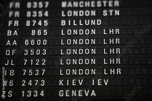 Departures board at the airport. Flight information mechanical timetable. Split flap mechanical departures board. Flight schedule