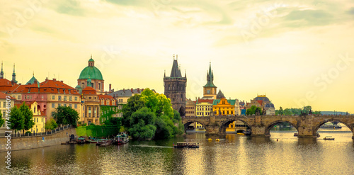 Sunset Landscape of the romantic city of Prague.Panoramic view of Charles bridge and old town on a summer day in the capital Czech Republic. Cruise on the Moldovan river.
