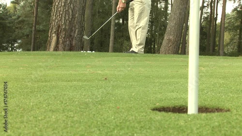 Chipping in from the edge of a golf green