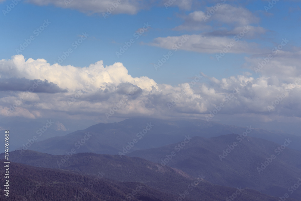 Mountains and blue sky with clouds, hipster landscape, toned