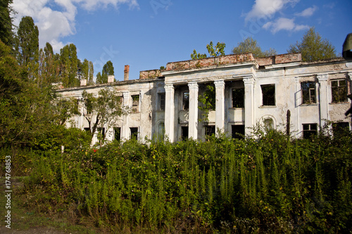 Abandoned and overgrown ruins of school named after Beria. Abkhazia, Georgia