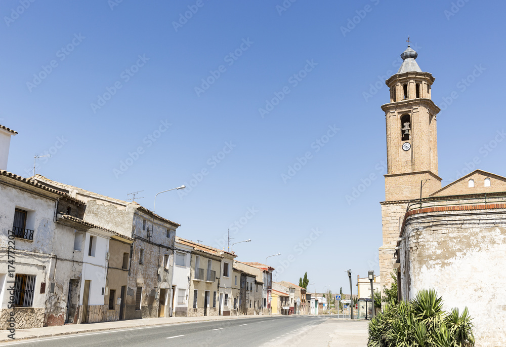 street and La Asuncion church in Candasnos town, province of Huesca, Aragon, Spain