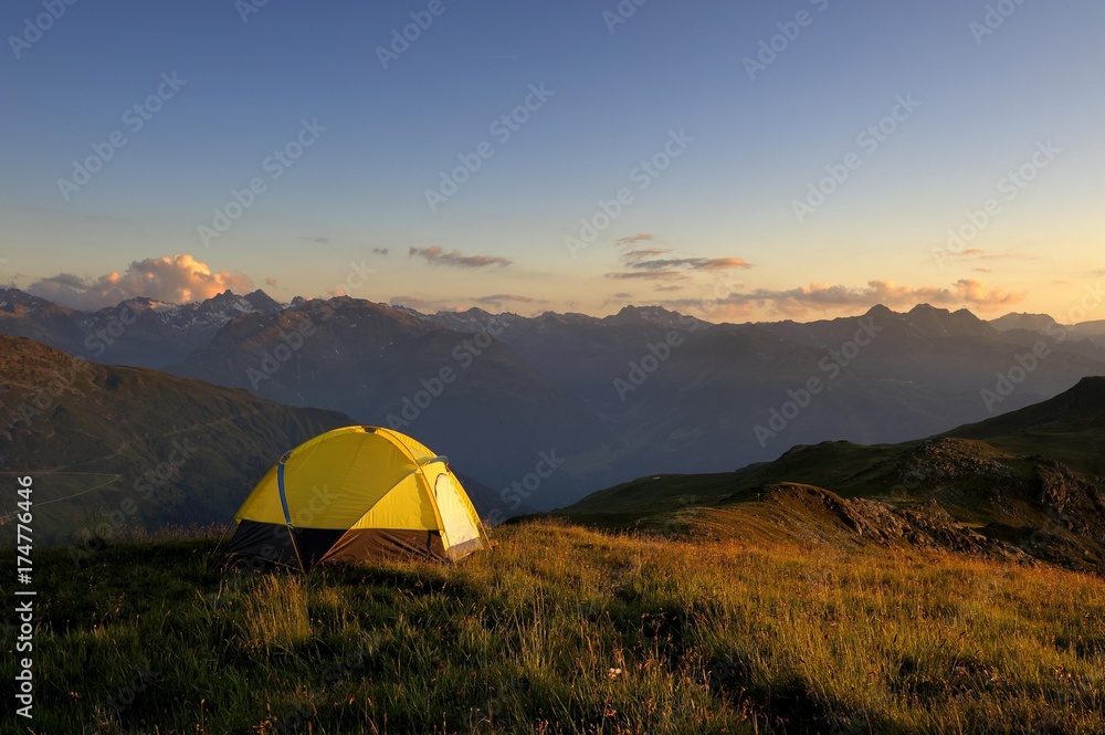 Tent in front of a mountain range in the last daylight, Gaschurn, Montafon, Vorarlberg, Austria, Europe