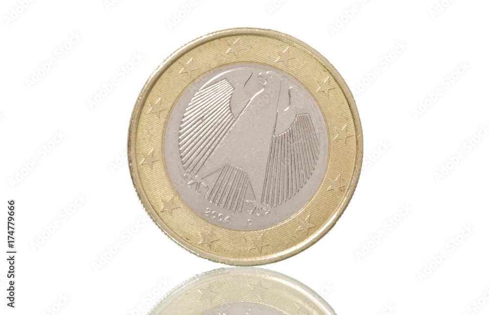 German euro coin, on slope, symbolic image for euro crisis German euro coin, on slope, symbolic image for euro crisis