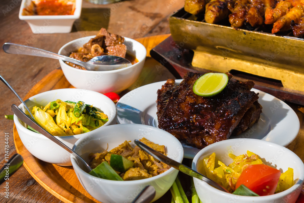 Traditional balinese sea food with satay and curry in Bali, Indo