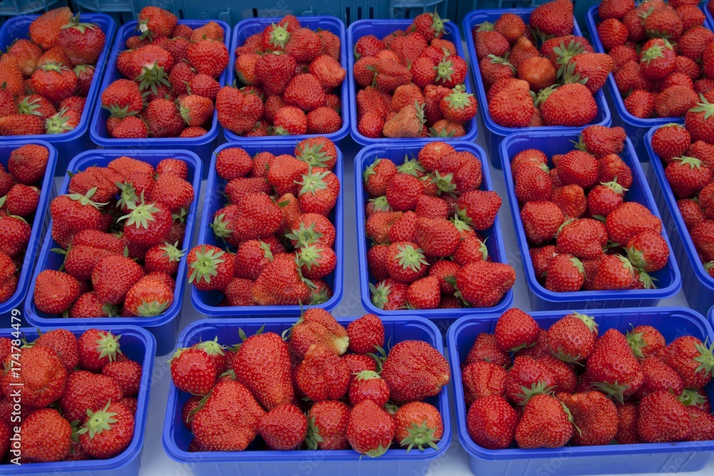 Bowls with strawberries on the market Bowls with strawberries on the market