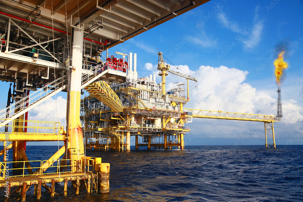 Fototapeta premium Offshore construction platform for production oil and gas. Oil and gas industry and hard work. Production platform and operation process by manual and auto function from control room.