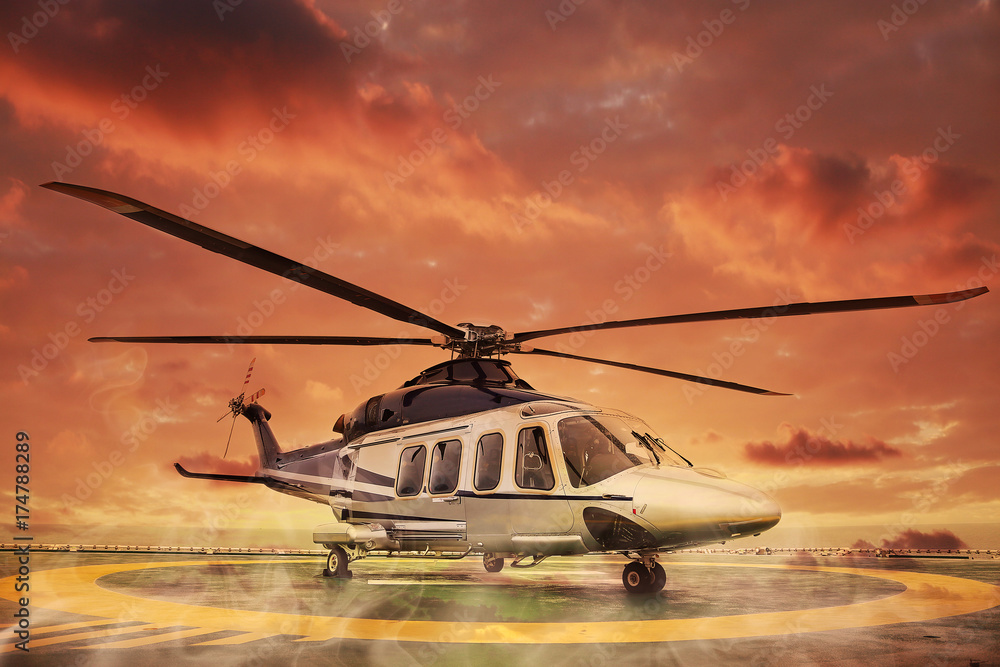 Fototapeta lądowanie śmigłowca na platformie offshore, załogi helikoptera lub pasażera do pracy w morskim przemyśle naftowym i gazowym, transport lotniczy dla pasażera pomocniczego, obsługa naziemna na lotnisku.